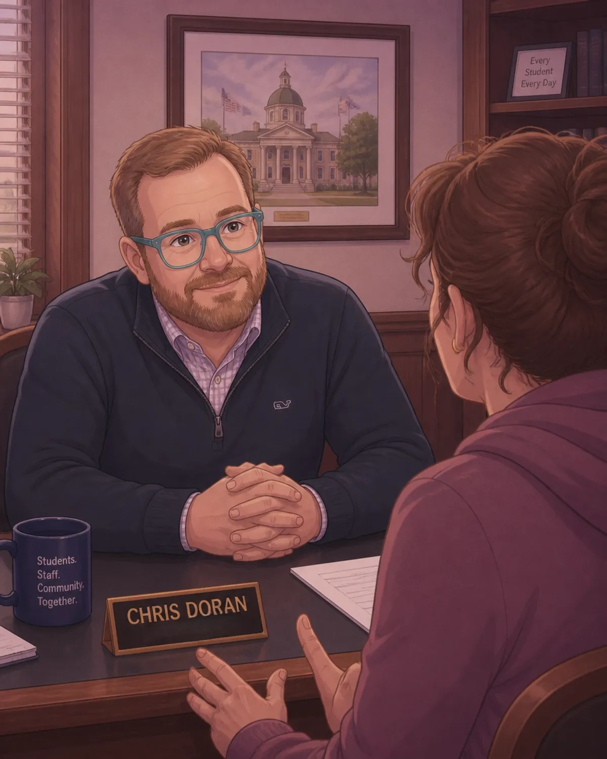 Attorney Chris Doran listening to a parent in his Vernon office